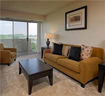 Spacious living room with floor to ceiling sliding windows