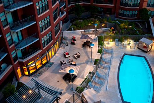 Sparkling pool and outdoor residence seating area Sparkling pool and outdoor residence seating area