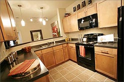 Spacious kitchen with sleek black appliances and great cabinet space Spacious kitchen with sleek black appliances and great cabinet space
