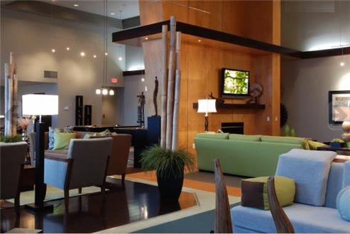 Residents' lounge with flat screen TV and comfortable seating