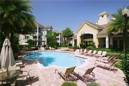 Well lit sundeck and pool Well lit sundeck and pool