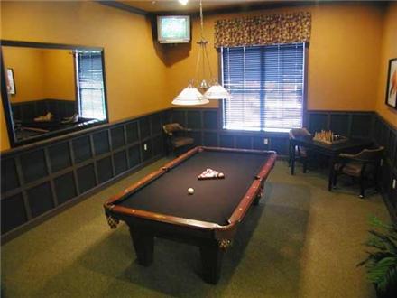 Game room with billiards table Game room with billiards table