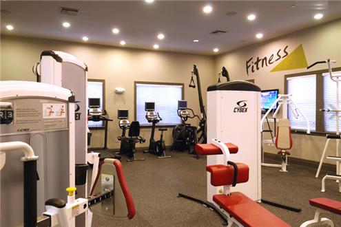 Fitness center with free weekly classes and on-site personal trainer Fitness center with free weekly classes and on-site personal trainer