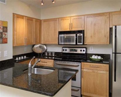Spacious kitchen with stainless steel appliances Spacious kitchen with stainless steel appliances
