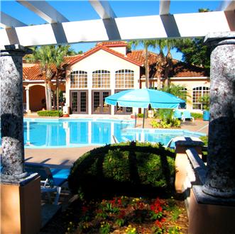 Sundeck and pool with chairs and tables Sundeck and pool with chairs and tables