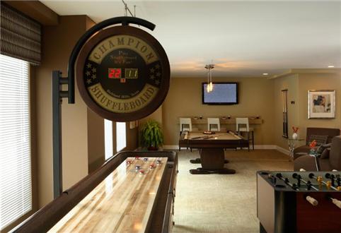 Game room with shuffle board and billiards tables Game room with shuffle board and billiards tables