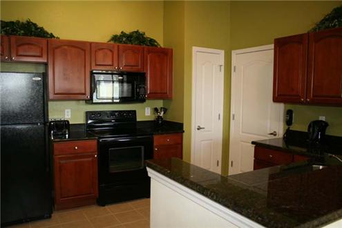 Kitchen with sleek black appliances Kitchen with sleek black appliances