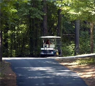 Golf cart path with golf cart charging stations Golf cart path with golf cart charging stations