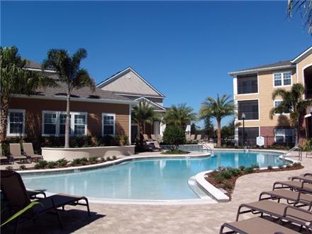 Sparkling pool and sundeck with poolside cabanas Sparkling pool and sundeck with poolside cabanas
